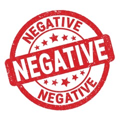 NEGATIVE text written on red round stamp sign.