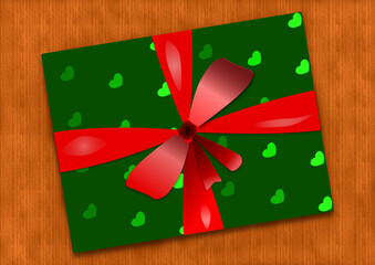 Posé sur une table en bois cadeau de Noël empaqueté dans du papier vert orné de coeurs et décoré d'un ruban rouge - obrazy, fototapety, plakaty