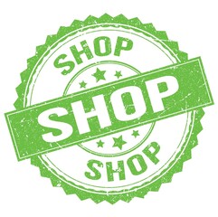 SHOP text on green round stamp sign