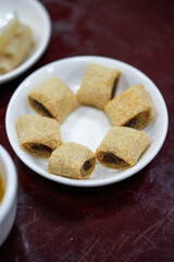 A plate of old Beijing traditional dessert snacks, donkey rolling