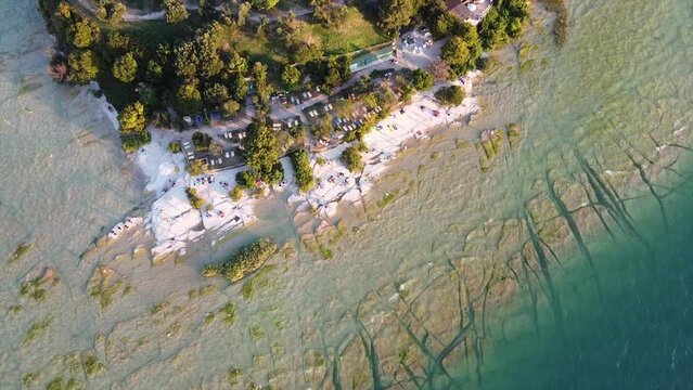 Jamaica Beach, Sirmione, Lake Garda (Italy) aerial view during beautiful sunset.
Lake Garda beautiful beach in Sirmione, Italy, crystal clear water.