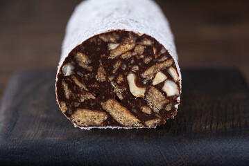 Dessert chocolate sausage salami without sugar, gluten and lactose, closeup.