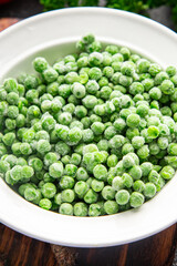 green pea frozen vegetable fresh snack healthy meal food on the table copy space food background rustic top view 