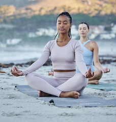 Beach meditation, diversity and yoga women meditate for chakra energy healing of soul, aura or...