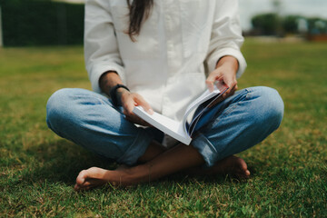 Girl Reading and Walking on Grass, Phone
