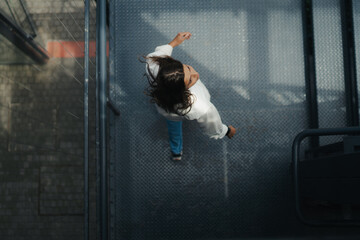 Girl Reading and Walking on Grass, Phone
