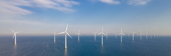 Windmill park with windmills turbines at sea