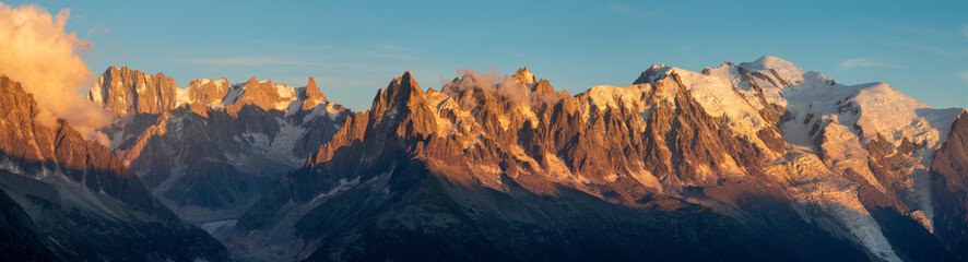 The panorama of Mont Blanc massif  Les Aiguilles towers and Grand Jorasses in the sunset light.