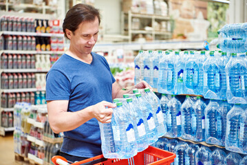 Man buy water in shop