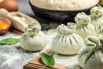 cooking Khinkali with cheese and spinach. Raw semi-finished products dumplings. National Georgian cuisine. place for text, top view