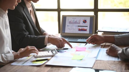 Business team collaboration discussing working analyzing with financial data and marketing growth report graph in team, presentation and digital tablet, laptop.