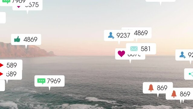 Animation of social media icons over sunset and sea landscape