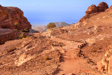 Sandstone canyon, pathway and rocks formations in Petra, Jordan, near Monastery Ad deir