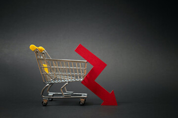 Drop in sales of a business. Decline in online orders of digital venture. Shopping cart with down...
