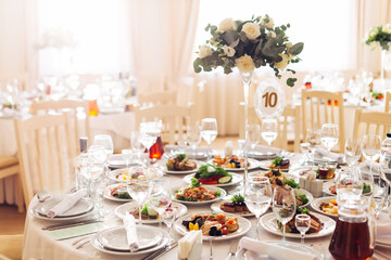 wedding reception. table with dishes and drinks decorated with a
