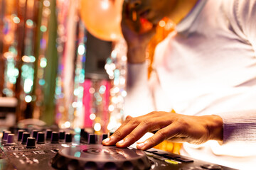 African american dj playing music at a nightclub, selective focus