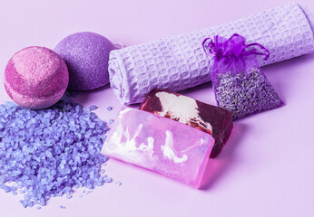 Spa accessories set. Towel, pumice stone, soap, bath salt and lavender in lilac lavender colors.