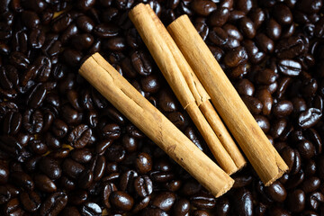 cinnamon sticks with coffee beans, photographed from the top
