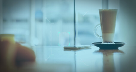 Image of a white QR code scanning over a cup of caffe latte standing