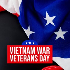 Fototapeta premium Composition of national vietnam war veterans day text over flag of usa