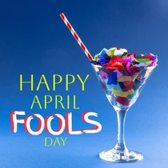 Fotobehang Composition of april fools day text over cocktail glass with confetti and straw © vectorfusionart