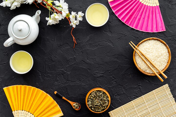 Asian tabble set with tan and cherry blossom branch, top view