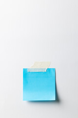 Blue sticky memo note with copy space on white background