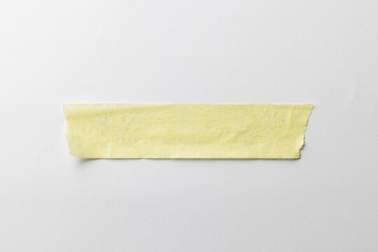 Yellow masking tape and copy space on white background