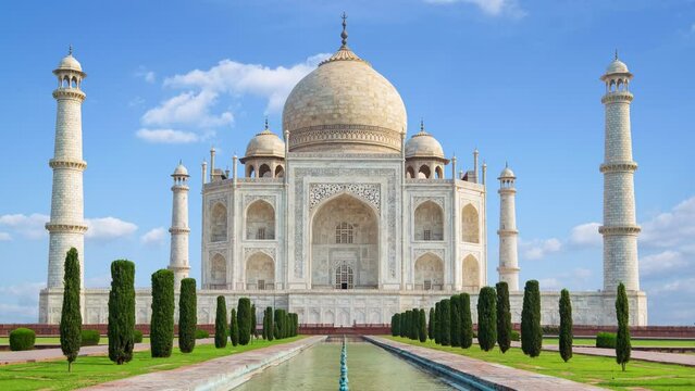 4K time lapse of Taj Mahal, an ivory-white marble mausoleum on the south bank of the Yamuna river in Agra, Uttar Pradesh, India. One of the seven wonders of the world.