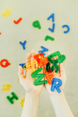 A woman holds letters in her hands
