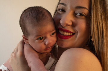 Baby in mother's arms.