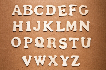 alphabet letters on a brown background
