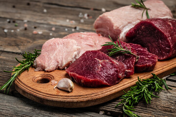 Different types of raw pork meat and beef. banner, menu, recipe place for text, top view