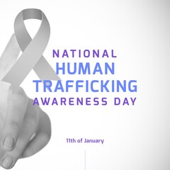 Image of national human trafficking awareness day on grey background with ribbon