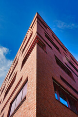 Fototapeta na wymiar a red brick house in germany, Leipzig with blue sky