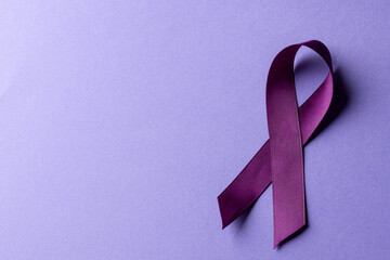 Composition of purple add or adhd awareness ribbon on purple background, with copy space