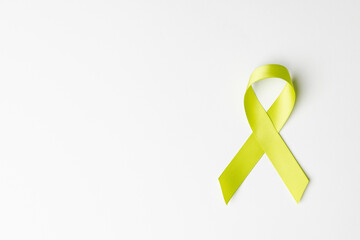 Close up of yellow ribbon on white background with copy space