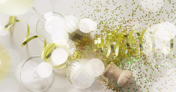 Animation of spots of light over gold confetti and champagne glasses