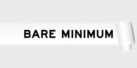 Fototapeta premium Ripped gray paper background that have word bare minimum under torn part