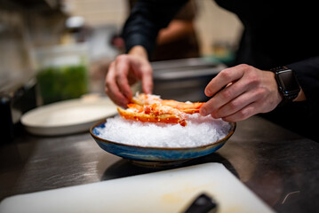 chef cooking crab legs with caviar on kitchen © pavel siamionov