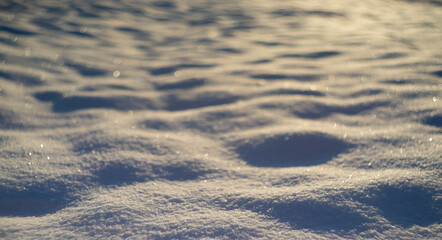 winter snow background - snow covered surface and artistic bokeh