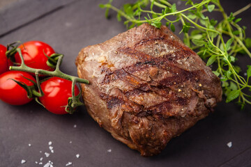 Lamb steak with cherry tomatoes and wine sauce. Delicious healthy traditional food closeup served for lunch in modern gourmet cuisine restaurant
