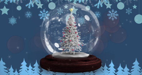 Fototapeta na wymiar Image of snow falling over snow globe with christmas tree
