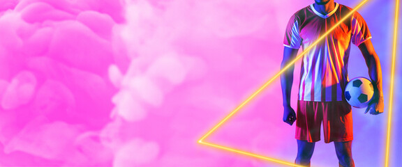 Midsection of african american man with ball and illuminated triangle over smoky pink background