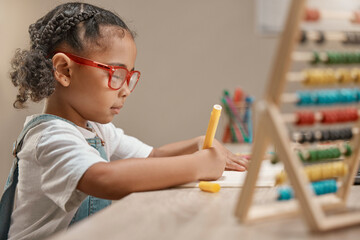 Education, girl or student drawing on paper or writing homework in notebook with artistic creativity. Development, learning or kindergarten school child with creative talent, concentration or focus