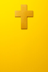 Composition of christian ash wednesday cross on yellow background with copy space
