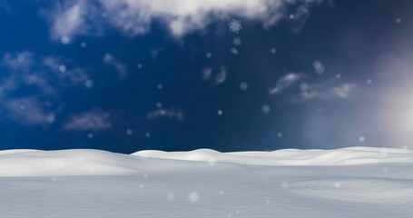 Fototapeta na wymiar Image of snow falling over winter landscape and sky