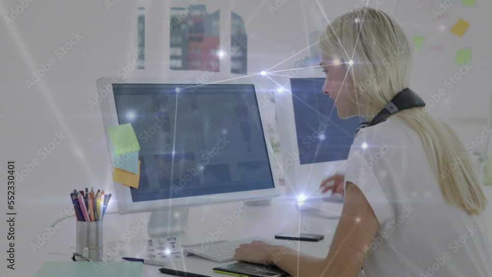 Aufkleber animation of network of connections against caucasian female graphic designer using computer
