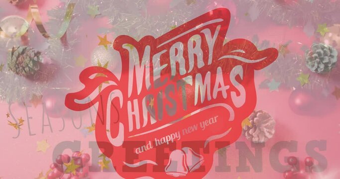 This video features a digitally generated animation of "merry christmas" text over pine cones
