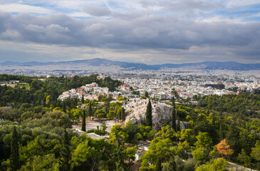 Fototapeta na wymiar Athens from above. Detail aerial view of the ancient city center of Athens from Acropole during a sunny day in Greece.